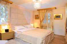 Спальня в пастельных тонах в отеле Per Astra