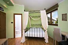 Спальня в Зеленом апартаменте отеля Wind Rose